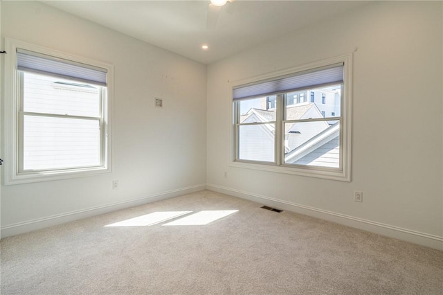 spare room with light carpet, baseboards, visible vents, ceiling fan, and recessed lighting