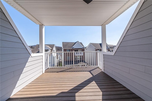 wooden deck featuring a residential view