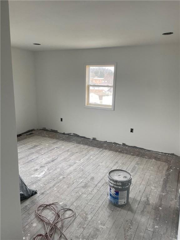 empty room featuring hardwood / wood-style flooring