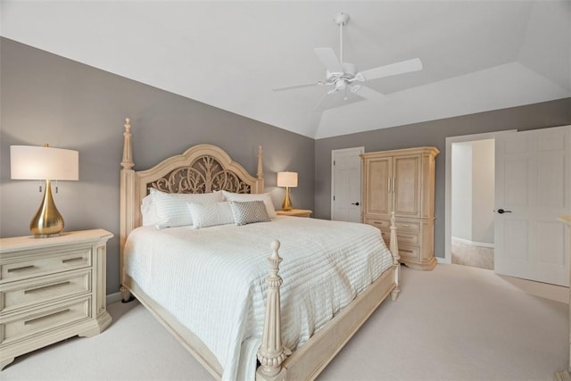 bedroom with lofted ceiling, ceiling fan, baseboards, and light colored carpet