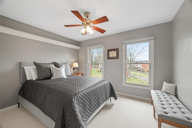 bedroom with carpet floors, baseboards, and a ceiling fan