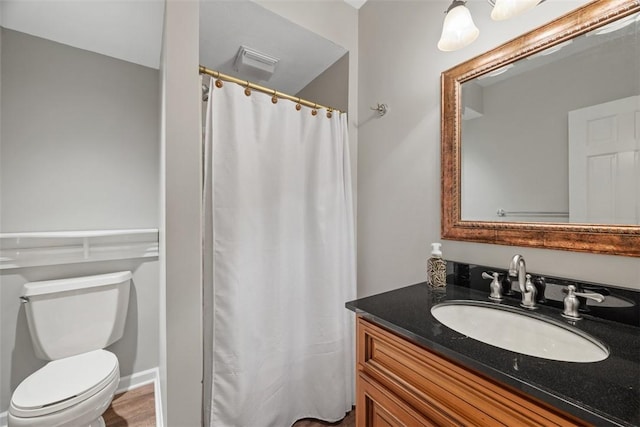 full bath featuring toilet, visible vents, and vanity