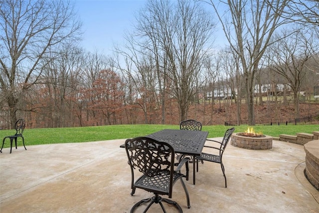 view of patio / terrace featuring an outdoor fire pit