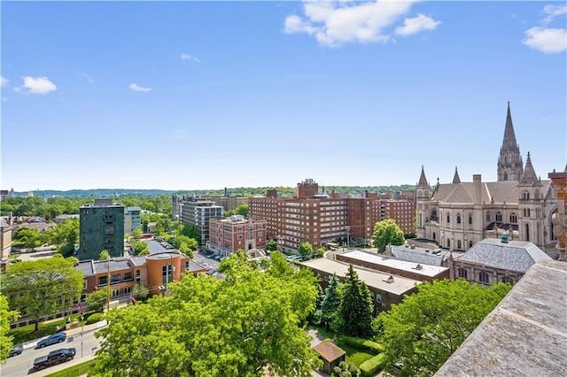 birds eye view of property with a city view