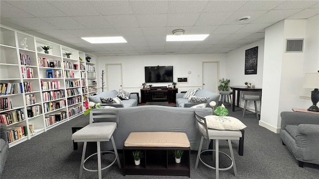 carpeted living area with visible vents