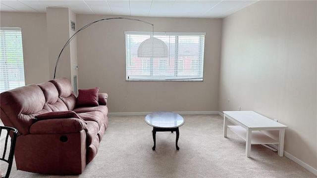 living room with carpet floors and baseboards