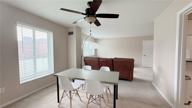 5 Bayard Rd Unit 113, Shadyside, PA 15213 - dining area with light colored carpet, baseboards, ceiling fan, and visible vents