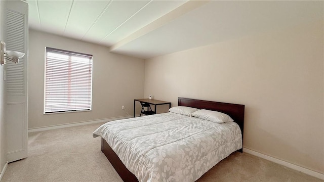 carpeted bedroom with baseboards