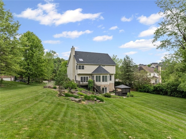 103 Ridgemont Dr, Cranberry Twp, PA 16066 - rear view of house featuring a yard, a chimney, stairs, and a wooden deck