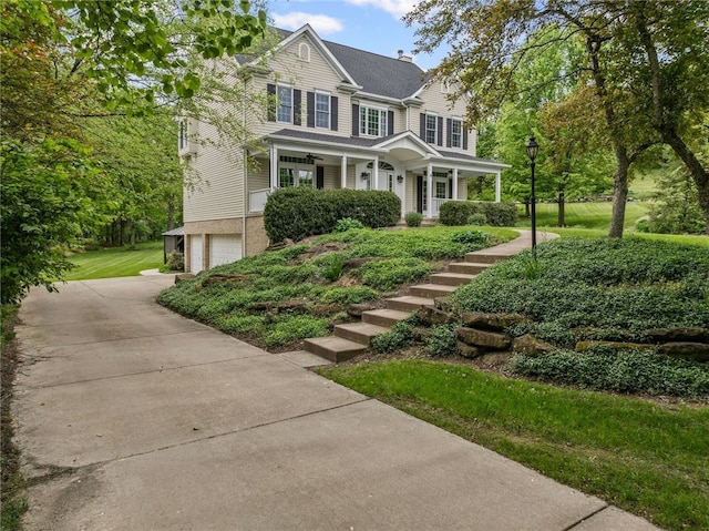 103 Ridgemont Dr, Cranberry Twp, PA 16066 - view of front of home with a garage, covered porch, driveway, a chimney, and stairs