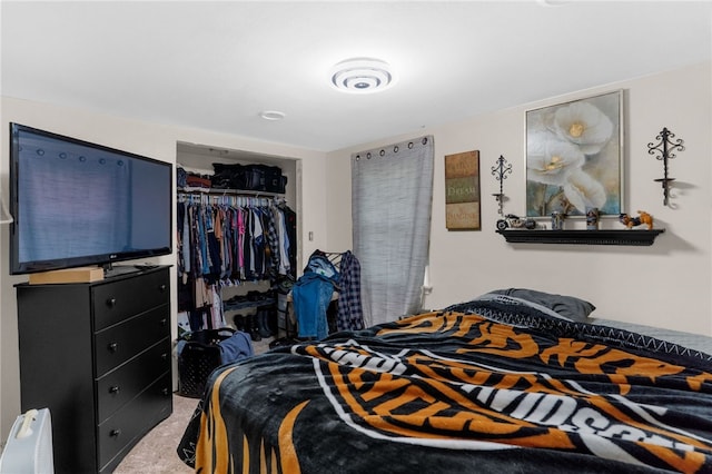 carpeted bedroom featuring a closet