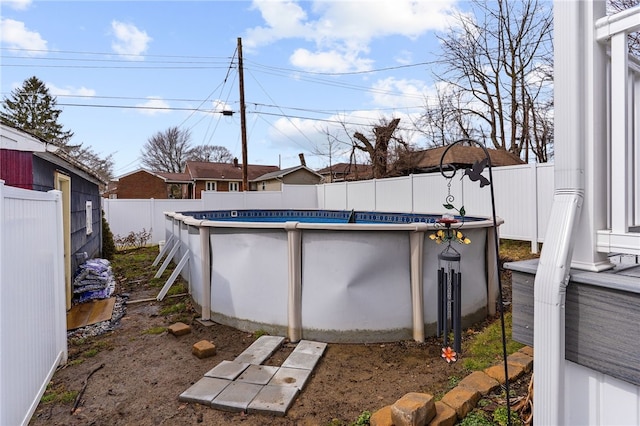 exterior space with a fenced backyard and a fenced in pool