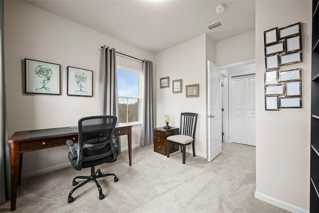 office area featuring carpet, visible vents, and baseboards