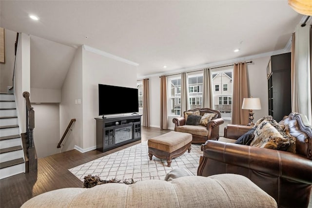 living room featuring recessed lighting, wood finished floors, baseboards, stairs, and crown molding