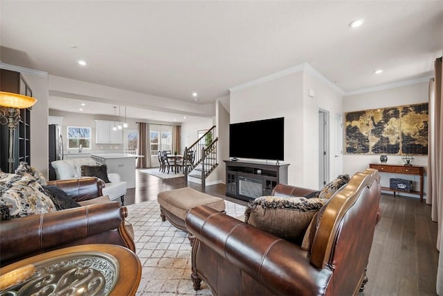 living room featuring ornamental molding, recessed lighting, and wood finished floors