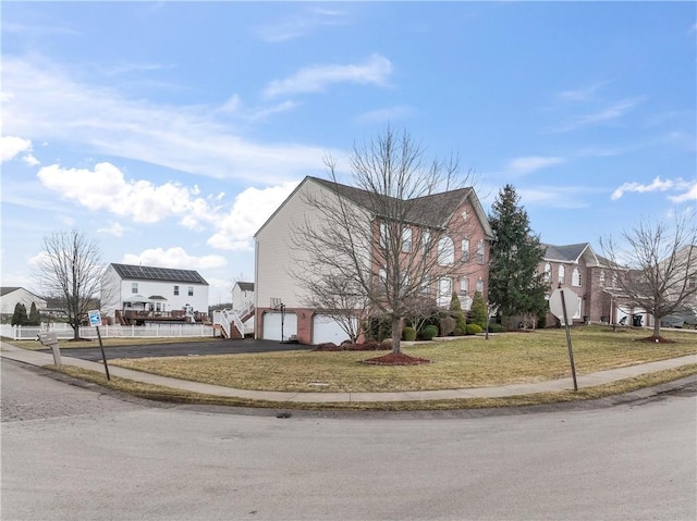 view of property exterior featuring a yard, an attached garage, and driveway