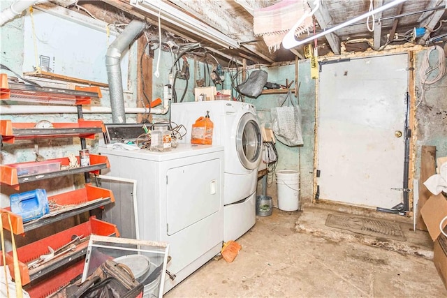 clothes washing area featuring laundry area and separate washer and dryer