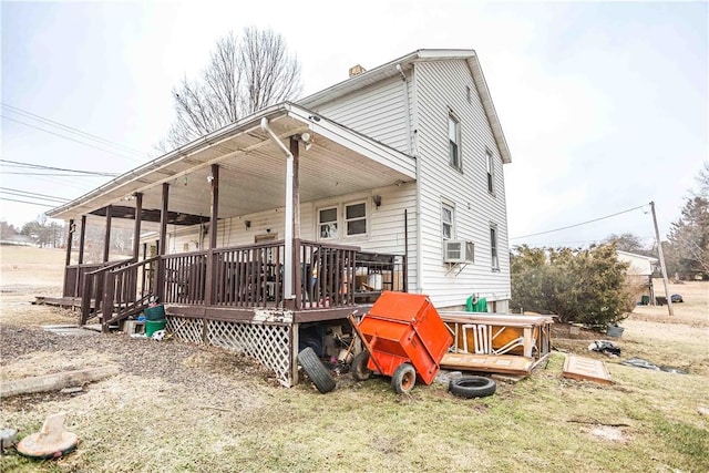 view of property exterior with a yard, cooling unit, and a wooden deck