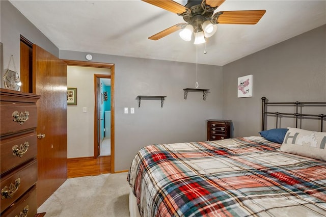 bedroom with carpet, baseboards, and ceiling fan