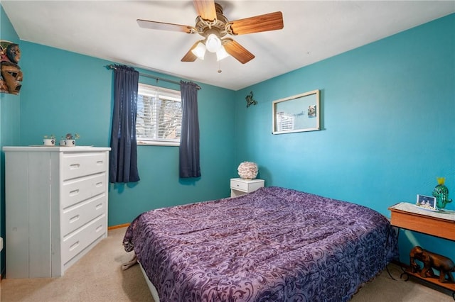 carpeted bedroom with ceiling fan