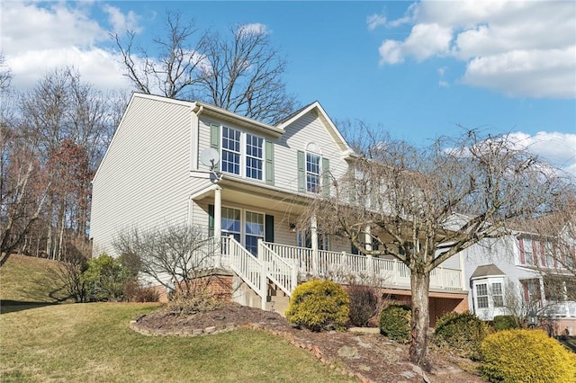 view of front of house featuring a porch and a front yard