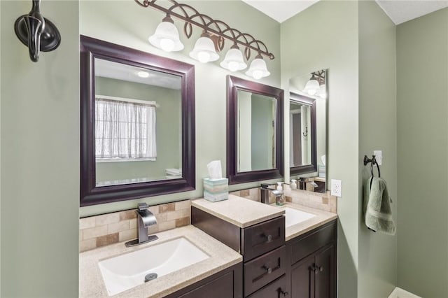 full bathroom with a sink, backsplash, and double vanity