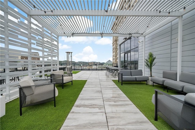 view of patio / terrace featuring outdoor lounge area and a pergola