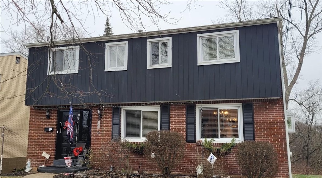 view of front of home featuring brick siding