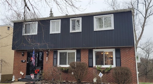 view of front of home featuring brick siding