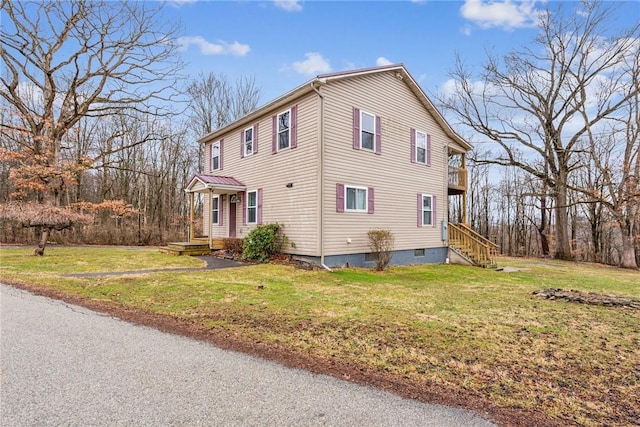 view of side of home featuring a yard