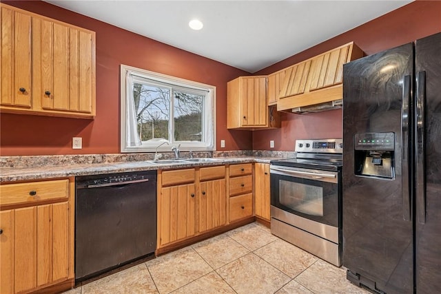 kitchen featuring light tile patterned flooring, light brown cabinets, under cabinet range hood, a sink, and black appliances