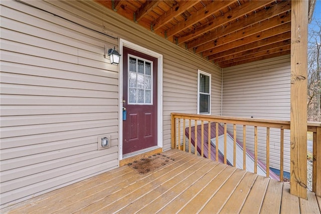 entrance to property with a deck