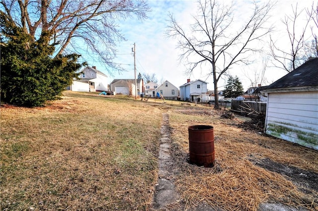 view of yard with fence and a residential view