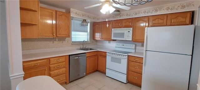 kitchen with white appliances, open shelves, a sink, and light countertops