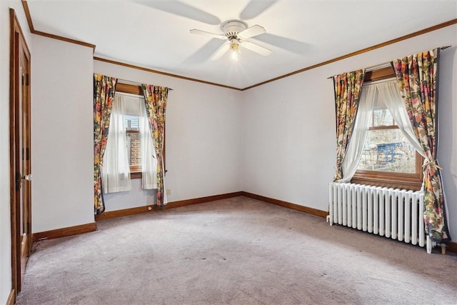 carpeted empty room with baseboards, ornamental molding, and radiator heating unit