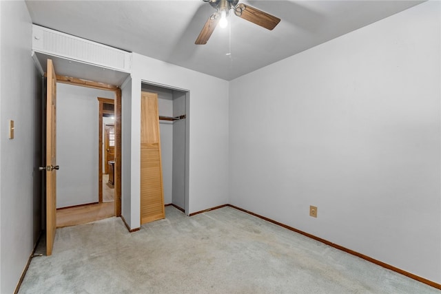 unfurnished bedroom featuring ceiling fan, baseboards, a closet, and light colored carpet