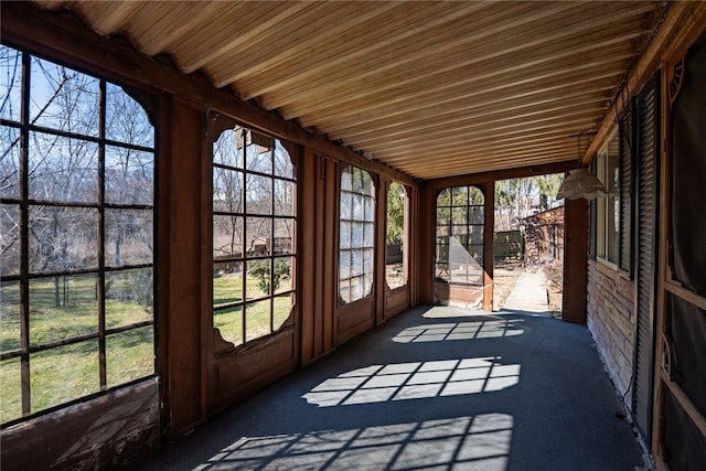 unfurnished sunroom with plenty of natural light