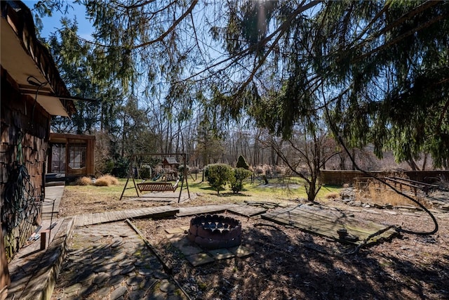 view of yard with an outdoor fire pit