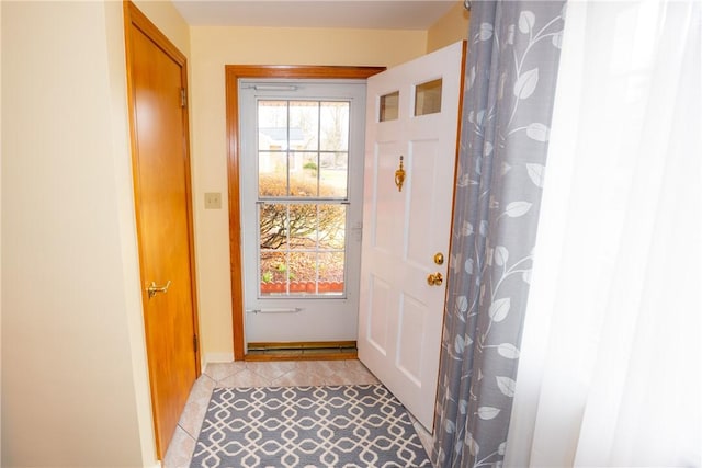 entryway featuring light tile patterned floors and a wealth of natural light