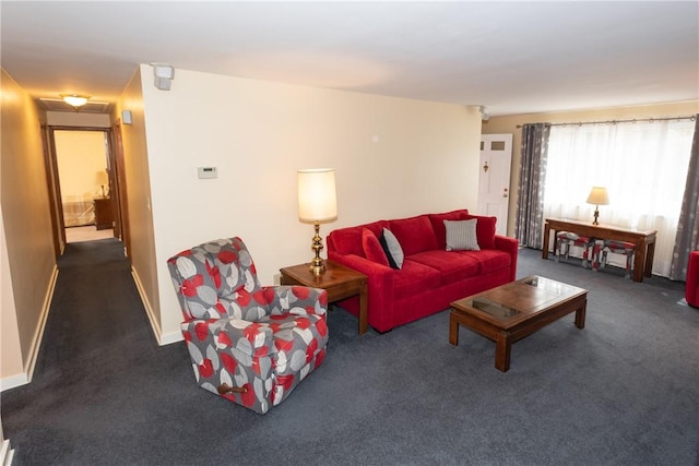 living room with carpet floors and baseboards