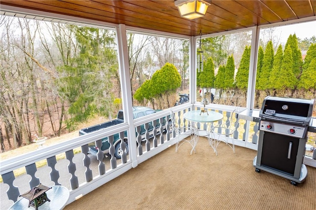 sunroom / solarium with wood ceiling