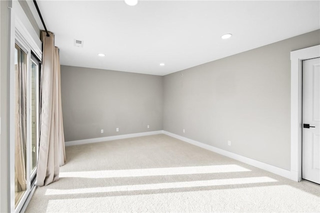 unfurnished bedroom featuring recessed lighting, carpet flooring, visible vents, and baseboards