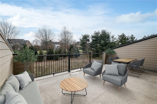 view of patio / terrace with a balcony and an outdoor hangout area