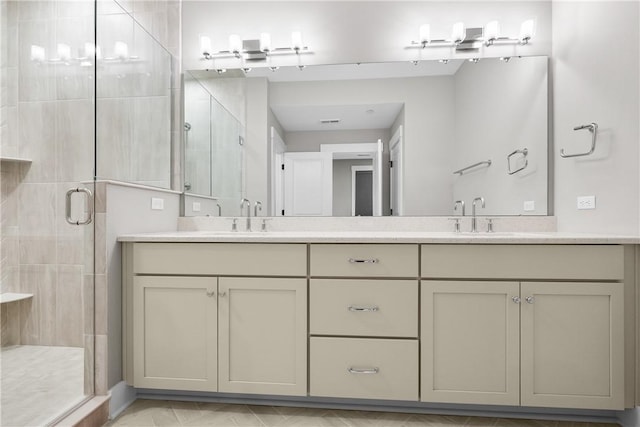 bathroom with a sink, a shower stall, and double vanity