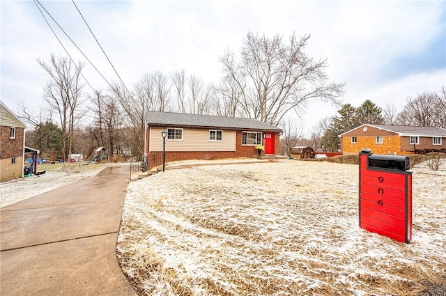 view of front of property featuring brick siding