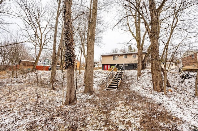 snowy yard with stairway