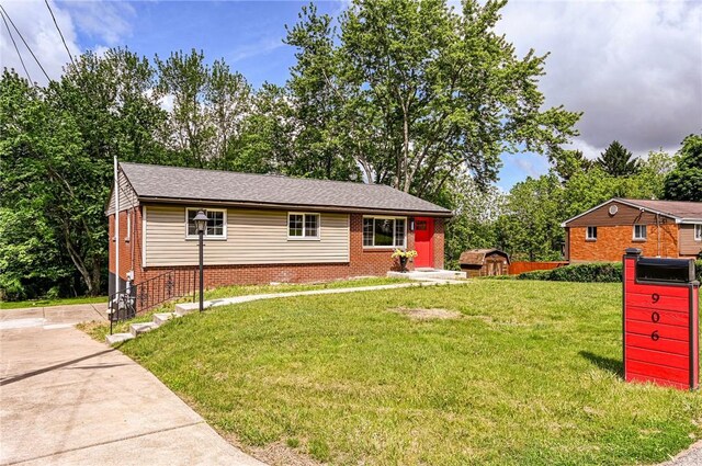 906 Tidal Terrace Dr, Shaler, PA 15101 - view of front of house featuring a front lawn, brick siding, and view of wooded area