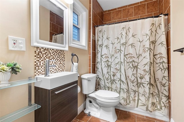 full bathroom with tasteful backsplash, vanity, toilet, and tile patterned floors