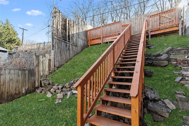 exterior space featuring a fenced backyard and stairway