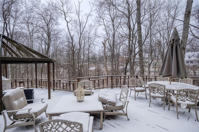 snow covered deck featuring an outdoor hangout area and outdoor dining area